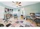 Bedroom with light blue walls, ceiling fan, and desk at 4079 S 50 W, Anderson, IN 46013
