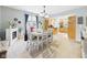 Dining room with a fireplace, dining table, view of kitchen, and bright natural light at 4079 S 50 W, Anderson, IN 46013