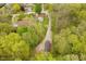 Picturesque aerial view of a home surrounded by lush greenery and mature trees in a serene neighborhood at 4091 W Briarwood Lake S Dr, Monrovia, IN 46157