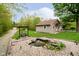 Scenic backyard with a charming pond and meticulously kept lawn at 4091 W Briarwood Lake S Dr, Monrovia, IN 46157