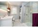 Modern bathroom featuring a glass-enclosed shower, washer/dryer, and sleek vanity at 4091 W Briarwood Lake S Dr, Monrovia, IN 46157