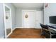 Bedroom featuring a full-length mirror, hardwood floors, closet, and natural light at 4091 W Briarwood Lake S Dr, Monrovia, IN 46157