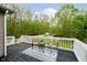 Relaxing deck area with outdoor furniture, perfect for enjoying the surrounding nature at 4091 W Briarwood Lake S Dr, Monrovia, IN 46157