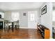 Bright dining area with modern table set, wood floor, and natural light at 4091 W Briarwood Lake S Dr, Monrovia, IN 46157