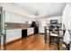 Modern kitchen with white cabinets, updated appliances, and wood flooring at 4091 W Briarwood Lake S Dr, Monrovia, IN 46157