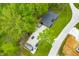 Overhead view of a home with gravel driveway surrounded by lush green trees, showcasing its secluded and private location at 4291 E Lakeview Dr, Martinsville, IN 46151