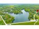 Breathtaking aerial view of a home by a serene lake, surrounded by lush greenery and natural beauty at 4291 E Lakeview Dr, Martinsville, IN 46151