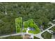 An aerial view showing the boundaries of a wooded lot with a house, surrounded by mature trees at 4291 E Lakeview Dr, Martinsville, IN 46151