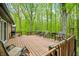 Spacious backyard deck with outdoor seating and forest views at 4291 E Lakeview Dr, Martinsville, IN 46151