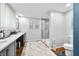 Bathroom featuring double sinks, updated vanity, a toilet, and a glass shower at 4291 E Lakeview Dr, Martinsville, IN 46151