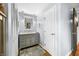 Charming bathroom with gray vanity, granite countertop, and decorative mirror and lighting at 4291 E Lakeview Dr, Martinsville, IN 46151