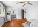 Spacious bedroom with hardwood floors, two entry doors, and views to the bathroom at 4291 E Lakeview Dr, Martinsville, IN 46151
