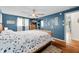Spacious bedroom with wood floors, a ceiling fan, and a large window with natural light at 4291 E Lakeview Dr, Martinsville, IN 46151