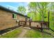 A backyard deck with brick home featuring a sliding door at 4291 E Lakeview Dr, Martinsville, IN 46151