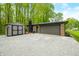Detached garage with an outdoor storage shed and gravel driveway offering lots of parking space at 4291 E Lakeview Dr, Martinsville, IN 46151