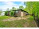 Brick home featuring a manicured lawn and wood deck at 4291 E Lakeview Dr, Martinsville, IN 46151