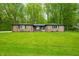 Charming brick ranch home with a lush green lawn and mature trees offering curb appeal at 4291 E Lakeview Dr, Martinsville, IN 46151