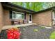 Inviting front porch with chairs, landscaping, and mulch, enhancing the home's exterior appeal at 4291 E Lakeview Dr, Martinsville, IN 46151