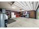 Spacious garage with organized storage, tool racks, and work area, providing ample space for projects and vehicles at 4291 E Lakeview Dr, Martinsville, IN 46151