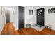 Hallway with hardwood floors and black doors at 4291 E Lakeview Dr, Martinsville, IN 46151