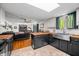Kitchen featuring stainless steel appliances, butcher block countertops, and stylish backsplash with adjoining living room at 4291 E Lakeview Dr, Martinsville, IN 46151