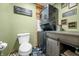 Unique laundry area with stacked washer/dryer and laundry themed wall decor at 4291 E Lakeview Dr, Martinsville, IN 46151