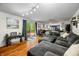 Open concept living space featuring hardwood floors, access to the kitchen and sliding glass doors at 4291 E Lakeview Dr, Martinsville, IN 46151