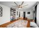 Bright living room featuring hardwood floors, shelving and a decorative rug at 4291 E Lakeview Dr, Martinsville, IN 46151