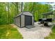 Outbuilding with a large door accompanied by a pontoon boat at 4291 E Lakeview Dr, Martinsville, IN 46151