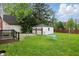 A lawn area showing a detached garage and patio seating at 4730 Rookwood Ave, Indianapolis, IN 46208