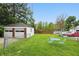 Spacious lawn area including a detached garage with patio seating at 4730 Rookwood Ave, Indianapolis, IN 46208