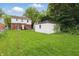 Backyard area showing the back of the house and detached garage at 4730 Rookwood Ave, Indianapolis, IN 46208