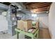 View of the unfinished basement showing mechanicals, utilities and work bench at 4730 Rookwood Ave, Indianapolis, IN 46208
