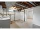 Finished basement features a laundry area, painted walls and exposed ductwork at 4730 Rookwood Ave, Indianapolis, IN 46208