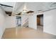 Open basement boasts stairs to the main floor, painted brick walls, and a large area for storage at 4730 Rookwood Ave, Indianapolis, IN 46208