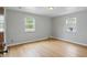 Bright bedroom features hardwood floors and two windows allowing for ample natural light at 4730 Rookwood Ave, Indianapolis, IN 46208