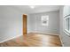 Bright bedroom with hardwood flooring, closet and natural light from the window at 4730 Rookwood Ave, Indianapolis, IN 46208