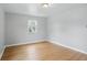 Bedroom with window and hardwood floors and light fixture at 4730 Rookwood Ave, Indianapolis, IN 46208