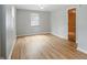 Bedroom with hardwood floors, window and closet with paneled door at 4730 Rookwood Ave, Indianapolis, IN 46208