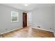 Bright, well-lit bedroom with hardwood flooring, one window, and neutral walls at 4730 Rookwood Ave, Indianapolis, IN 46208