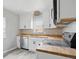 A bright kitchen featuring stainless appliances, butcher block counters and white cabinets at 4730 Rookwood Ave, Indianapolis, IN 46208