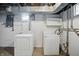 Laundry room features a washing machine and dryer, painted white walls, and window for natural light at 4730 Rookwood Ave, Indianapolis, IN 46208
