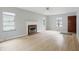 Bright living room with a fireplace, hardwood floors, and neutral paint, ready for your personal touch at 4730 Rookwood Ave, Indianapolis, IN 46208