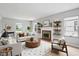 Bright living room boasts a fireplace, neutral tones, and modern decor for a cozy atmosphere at 4730 Rookwood Ave, Indianapolis, IN 46208