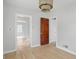 Bright living room with hardwood flooring, open floor plan, and modern lighting at 4730 Rookwood Ave, Indianapolis, IN 46208