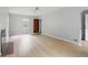 Open living room with hardwood flooring, fireplace, and bright neutral paint at 4730 Rookwood Ave, Indianapolis, IN 46208