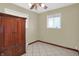 Bright bedroom featuring lots of sunlight, tile floors, and a built-in wood cabinet for added storage at 5027 E 40Th St, Indianapolis, IN 46226