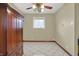 Bedroom features tiled floor, built in wood cabinet and modern ceiling fan at 5027 E 40Th St, Indianapolis, IN 46226