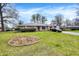 Well-maintained single-story brick home with a lovely lawn and a paved driveway at 5027 E 40Th St, Indianapolis, IN 46226
