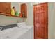 Functional laundry room with a washer, a dryer, and built-in storage shelves for convenience at 5027 E 40Th St, Indianapolis, IN 46226